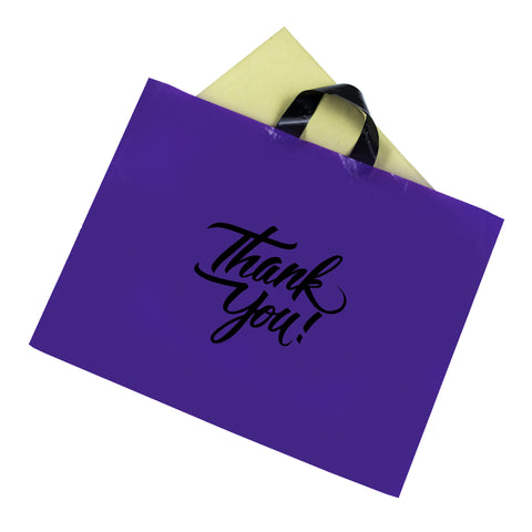 purple thank you loop handle bag with object inside it