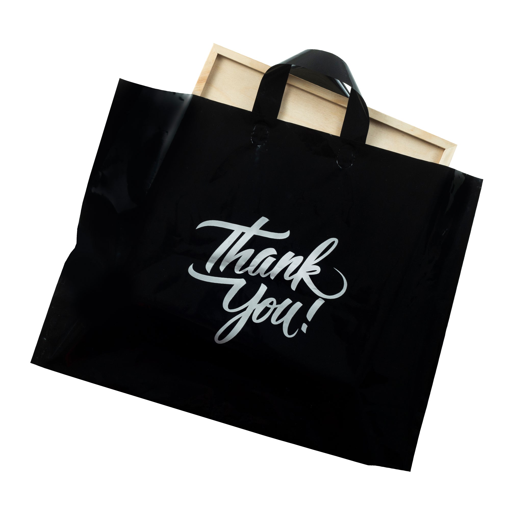 black thank you bag with object inside