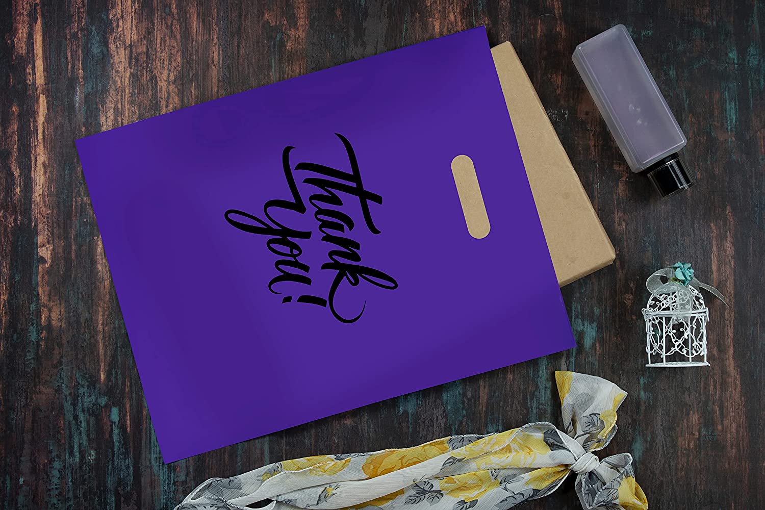 real life image of purple thank you bag with object inside